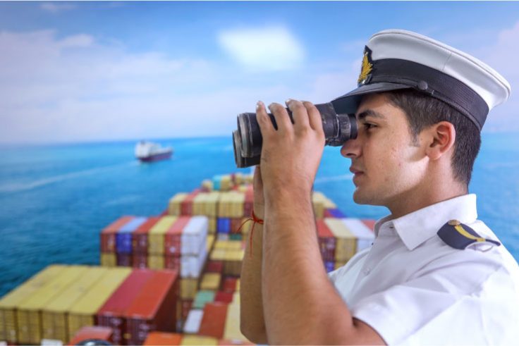 Merchant navy officer on the bridge of a cargo ship, illustrating merchant navy ranks and career progression