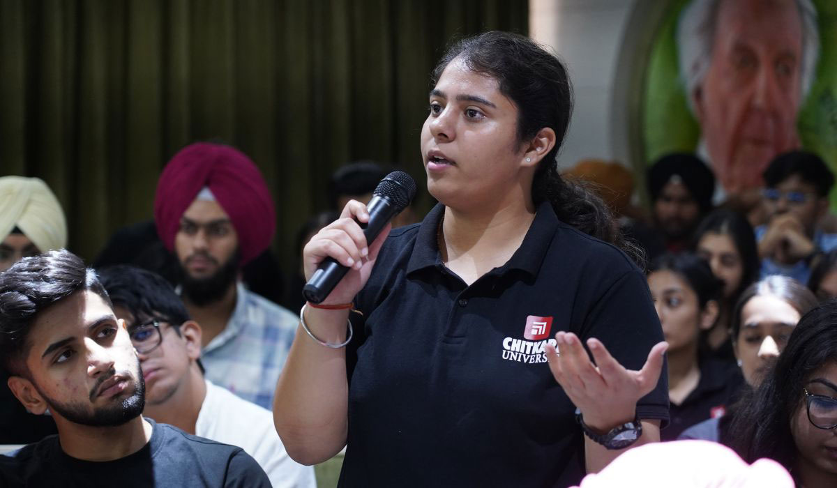 Student asking a question during a university session about Digital Marketing BBA worth and career opportunities