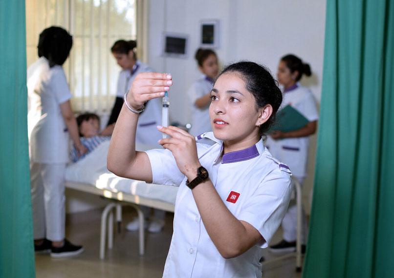 Nursing student preparing syringe during clinical practice session for better career scope