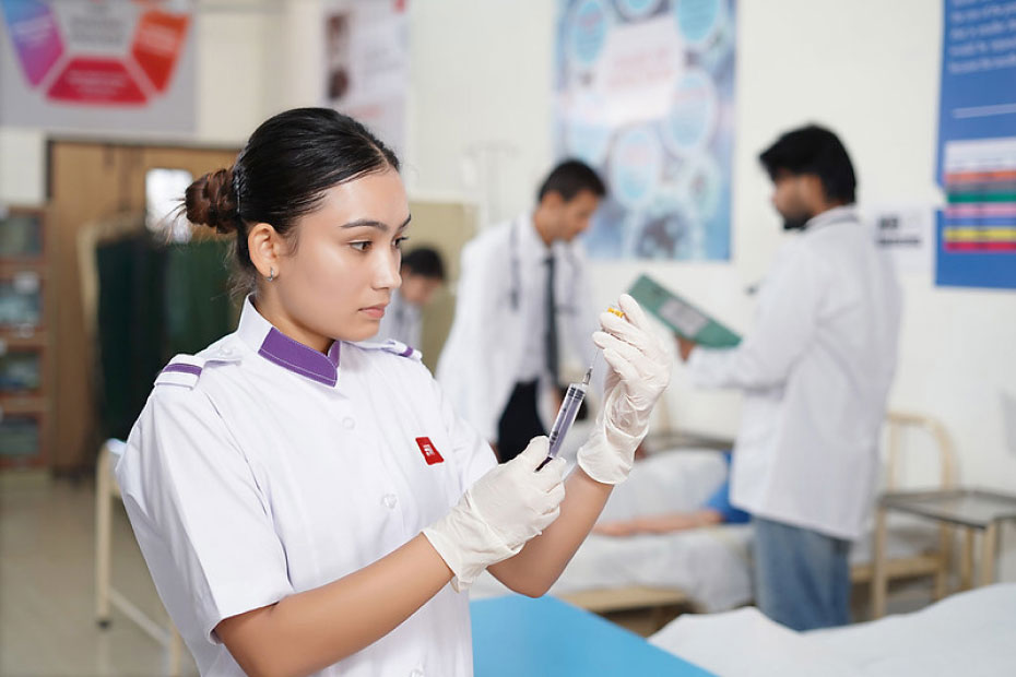 Nursing student practicing injection preparation in clinical lab