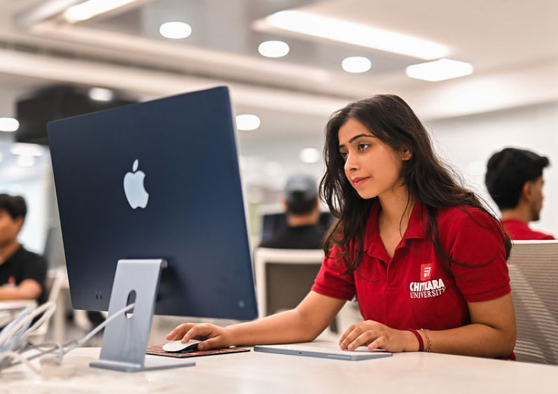 Student coding on desktop in 4-Year B.E. in Computer Science & Engineering lab