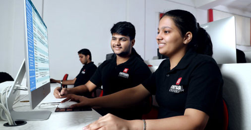 Student developing software on laptop in Computer Science Engineering program lab