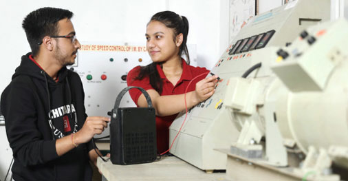 Students using electrical machine in Electrical Engineering lab
