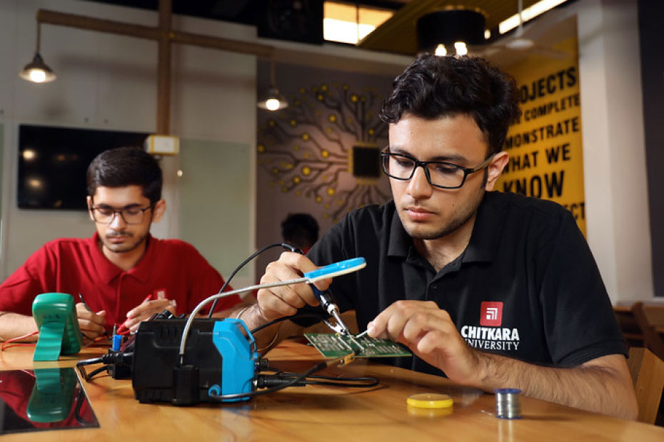 Students working on circuit design and PCB soldering in B.E. Electronics & Communication Engineering