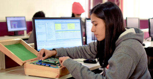 Student working on embedded systems and microcontroller setup in ECE program