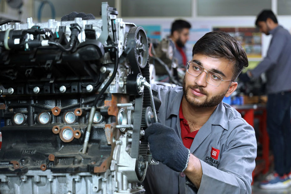 Students working on mechanical machines in B.E. Mechanical Engineering at Chitkara University