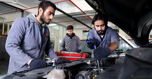 Students performing mechanical engineering experiments in lab