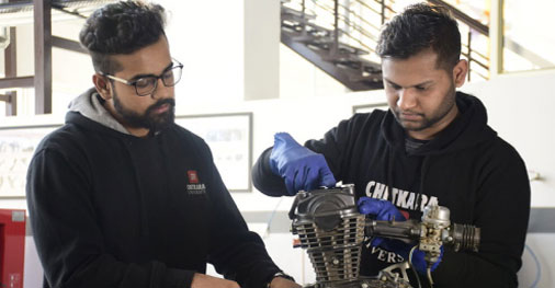 Student working on mechanical engineering setup and practical task