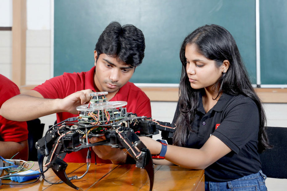 B.E. in Mechatronics Engineering students working on robotics and automation systems