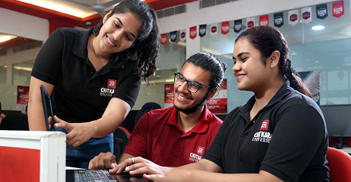 Students studying BCA program curriculum including coding and software development
